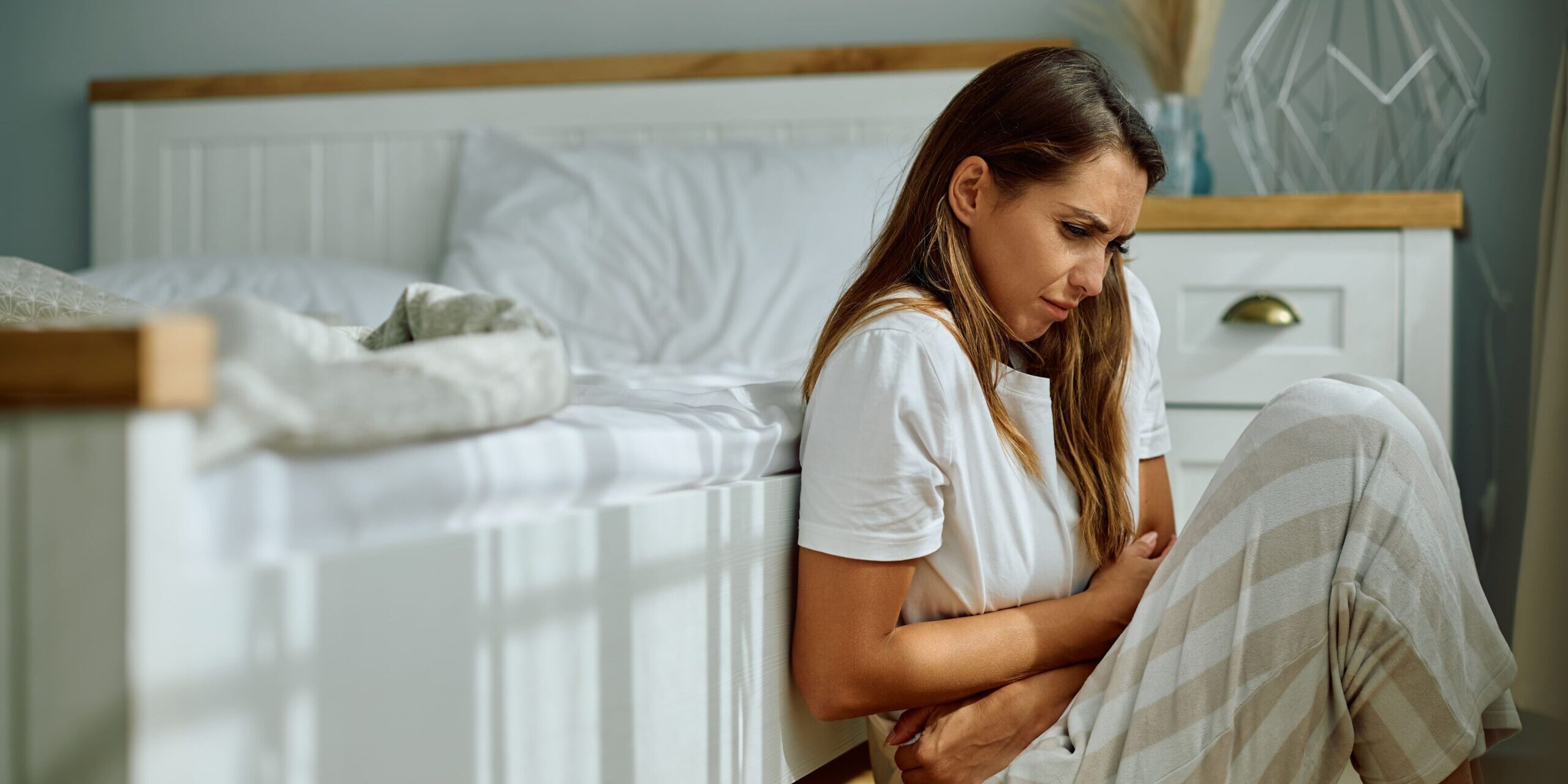 young-woman-suffering-from-stomach-cramps-in-the-m-2024-10-12-03-32-14-utc (1)